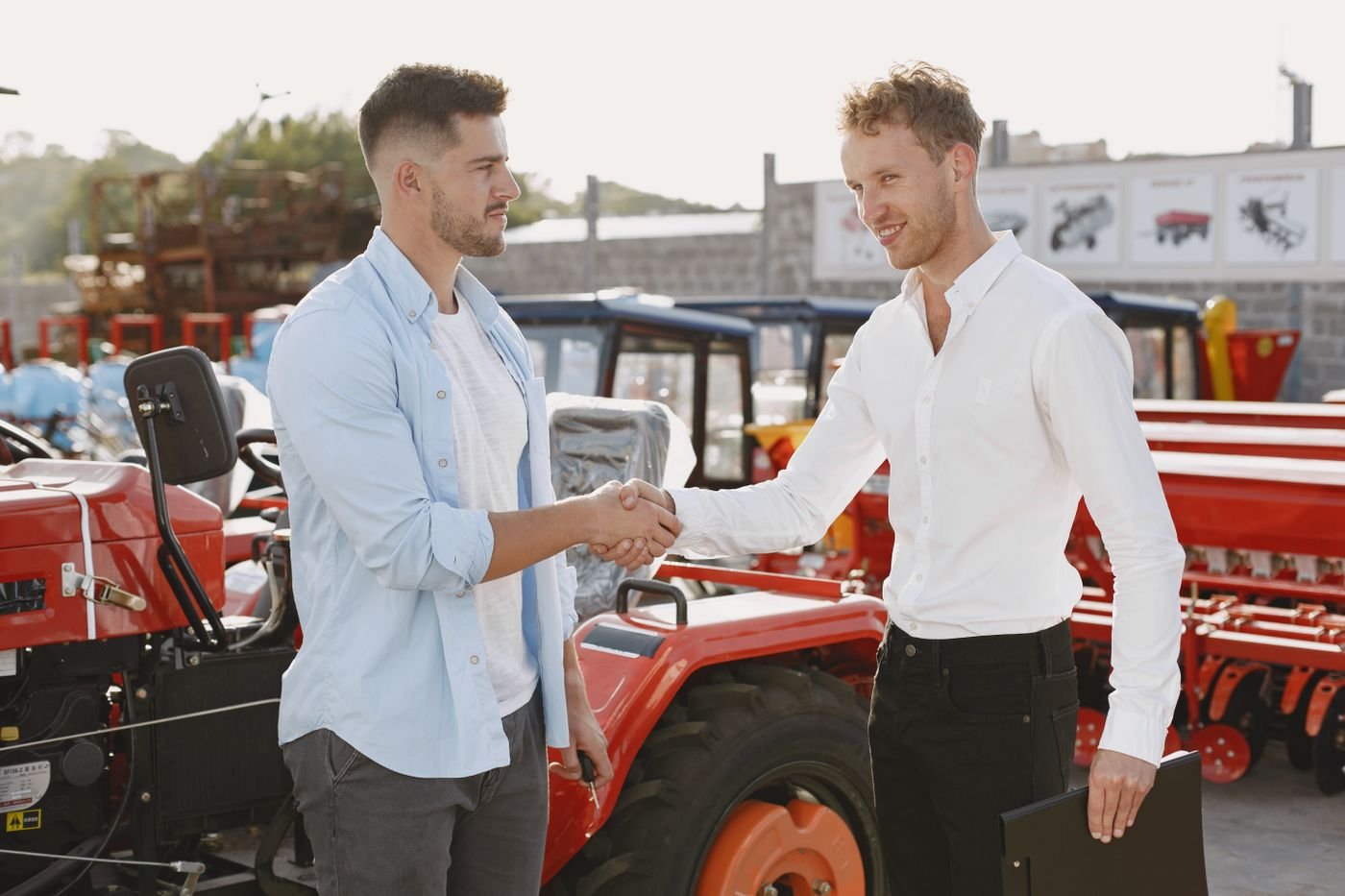 Handshake at a machinery dealership