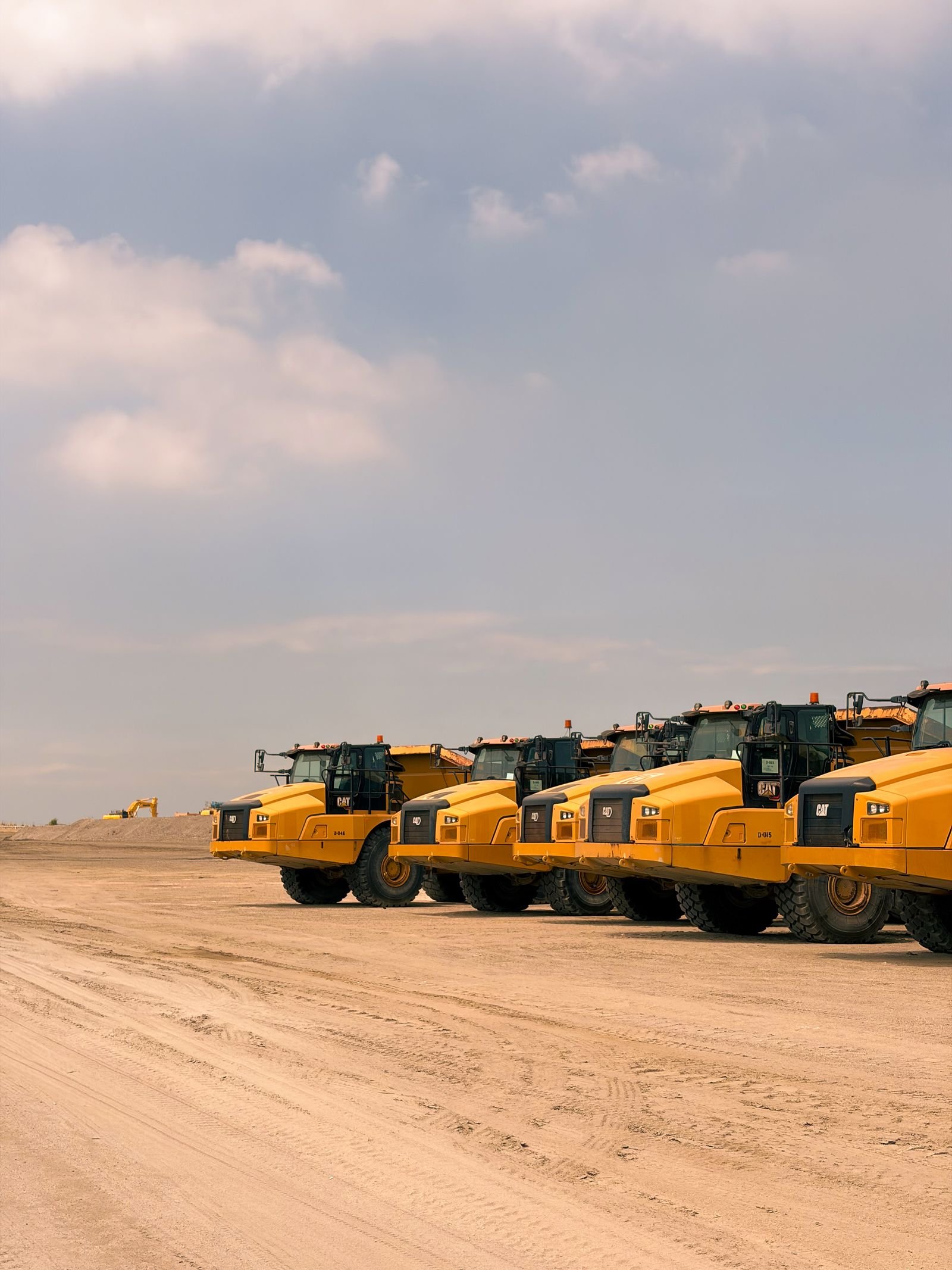 Line of haul trucks at a work site